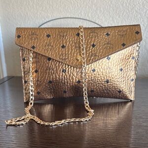 MCM Metallic Gold Monogram Envelope Clutch